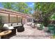Charming outdoor patio featuring cozy seating, a covered area, and serene landscaping for relaxation at 2000 Tyvola Rd, Charlotte, NC 28210