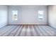 Neutral bedroom shows carpet and large windows for ample natural light at 2541 Ruby Dixon Crossing Dr # 18, Gastonia, NC 28056