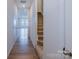 Hallway with wood flooring, a staircase, and doorway leading to the living area at 2541 Ruby Dixon Crossing Dr # 18, Gastonia, NC 28056