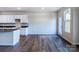 Open floorplan shows kitchen, dining area with natural light, and wood-look flooring at 2541 Ruby Dixon Crossing Dr # 18, Gastonia, NC 28056