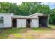 Exterior view of a barn with white sliding doors and an attached hay storage area at 2865 Water Plant Rd, Maiden, NC 28650