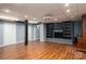 Finished basement with a black fireplace, shelving and laminate flooring at 2865 Water Plant Rd, Maiden, NC 28650