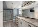 Modern bathroom featuring granite countertops, walk-in shower and a large mirror at 2865 Water Plant Rd, Maiden, NC 28650