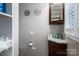 Powder room featuring a corner sink and a window with blinds at 2865 Water Plant Rd, Maiden, NC 28650