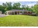Charming brick home featuring a large front lawn and a covered side porch, perfect for outdoor living at 2865 Water Plant Rd, Maiden, NC 28650