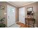 Inviting foyer featuring hardwood floors, a stylish mirror, and a well-lit entrance to welcome guests at 2865 Water Plant Rd, Maiden, NC 28650