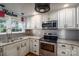 Modern kitchen boasts stainless steel appliances, granite countertops and tiled backsplash at 2865 Water Plant Rd, Maiden, NC 28650