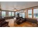 Living room with laminate floors, neutral walls, and a leather sofa at 2865 Water Plant Rd, Maiden, NC 28650