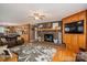 Cozy living room with a brick fireplace, custom built-ins, and an open layout for comfortable living at 2865 Water Plant Rd, Maiden, NC 28650
