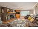 Warm living room featuring a brick fireplace, hardwood floors, and a relaxing atmosphere at 2865 Water Plant Rd, Maiden, NC 28650