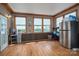 Bright sunroom featuring neutral walls, wood-look floors, and natural light at 2865 Water Plant Rd, Maiden, NC 28650