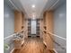 Expansive walk-in closet provides generous storage with custom shelving and organizers at 2865 Water Plant Rd, Maiden, NC 28650