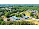 A high, scenic aerial of the real estate location in a community with lush green trees at 3042 N Oxford St, Claremont, NC 28610
