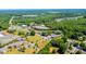 A beautiful high aerial view showing the commercial property and surrounding community at 3042 N Oxford St, Claremont, NC 28610