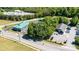 Aerial view of a building and a parking lot surrounded by trees at 3042 N Oxford St, Claremont, NC 28610