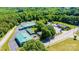 Aerial view of buildings and parking lots surrounded by trees at 3042 N Oxford St, Claremont, NC 28610