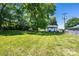 A spacious backyard with a house, a shed and some trees in the background at 3042 N Oxford St, Claremont, NC 28610