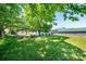 A metal shed in the backyard surrounded by trees and grass at 3042 N Oxford St, Claremont, NC 28610