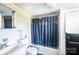 Basic bathroom with a shower-tub combination and vanity with potential for cosmetic updates at 3042 N Oxford St, Claremont, NC 28610