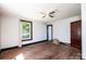 Bedroom with a ceiling fan and hardwood floors; natural light and closet space for comfortable living at 3042 N Oxford St, Claremont, NC 28610