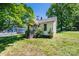 The home's exterior is framed by lush greenery, adding to its curb appeal and inviting atmosphere at 3042 N Oxford St, Claremont, NC 28610