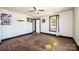 A room shows hardwood floors and trim with a view of the outside through large windows at 3042 N Oxford St, Claremont, NC 28610