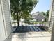 Balcony view showcasing neighborhood street with green trees and neighboring homes at 4135 Twenty Grand Dr, Indian Trail, NC 28079