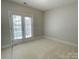Bedroom with neutral carpet, double french doors, and natural light at 4135 Twenty Grand Dr, Indian Trail, NC 28079