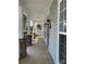 Spacious front porch featuring stone columns, neutral siding, and decorative outdoor lighting at 4135 Twenty Grand Dr, Indian Trail, NC 28079