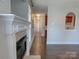 Hallway view towards living room, featuring fireplace and view to kitchen at 4135 Twenty Grand Dr, Indian Trail, NC 28079