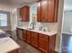 Kitchen featuring wood cabinetry, stainless steel appliances, and white countertops at 4135 Twenty Grand Dr, Indian Trail, NC 28079