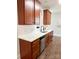 Kitchen with wooden cabinets, stainless steel dishwasher, white subway tile backsplash, and light countertops at 4135 Twenty Grand Dr, Indian Trail, NC 28079