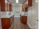 Kitchen with stainless steel appliances, wood cabinets, and subway tile backsplash at 4135 Twenty Grand Dr, Indian Trail, NC 28079
