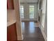 Bright living room with wood floors, fireplace, and multiple windows allowing natural light at 4135 Twenty Grand Dr, Indian Trail, NC 28079
