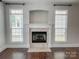Cozy living room featuring a marble fireplace and lots of natural light at 4135 Twenty Grand Dr, Indian Trail, NC 28079