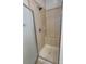 Shower featuring neutral tile, updated fixtures, and a built-in seat at 4135 Twenty Grand Dr, Indian Trail, NC 28079