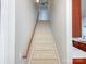 Carpeted staircase with wood banister leading to the upper level of the home at 4135 Twenty Grand Dr, Indian Trail, NC 28079