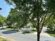 Street view with mature trees, sidewalks, and well-maintained lawns in a residential neighborhood at 4135 Twenty Grand Dr, Indian Trail, NC 28079