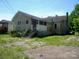 Exterior shot of the side and back of a house, with overgrown greenery at 418 W Cemetery St, Salisbury, NC 28144