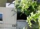 View of basement with overgrown leaves and bushes, with electrical attached at 418 W Cemetery St, Salisbury, NC 28144