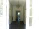 Hallway with an overhead light fixture and doors opening into other rooms at 418 W Cemetery St, Salisbury, NC 28144