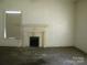 Living Room with fireplace, and a large window at 418 W Cemetery St, Salisbury, NC 28144