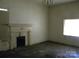 Living Room with fireplace, and a large window at 418 W Cemetery St, Salisbury, NC 28144