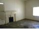 Living Room with fireplace, and a large window at 418 W Cemetery St, Salisbury, NC 28144