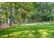 Spacious backyard with a fun playset, perfect for children at 4389 Enchantment Cove Ln, Charlotte, NC 28216