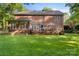 Expansive backyard with a large deck perfect for outdoor entertaining at 4389 Enchantment Cove Ln, Charlotte, NC 28216