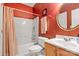 Full bathroom featuring a tub and shower combo, vanity with sink and decorative wallpaper at 4389 Enchantment Cove Ln, Charlotte, NC 28216