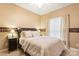 Cozy bedroom featuring a queen bed, nightstands, and a window with natural light at 4389 Enchantment Cove Ln, Charlotte, NC 28216