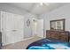 Bedroom with neutral carpet, gray walls, and a view to the closet and doorway at 4389 Enchantment Cove Ln, Charlotte, NC 28216