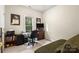 Bedroom or home office with neutral walls and carpet, desk, and daybed at 4389 Enchantment Cove Ln, Charlotte, NC 28216